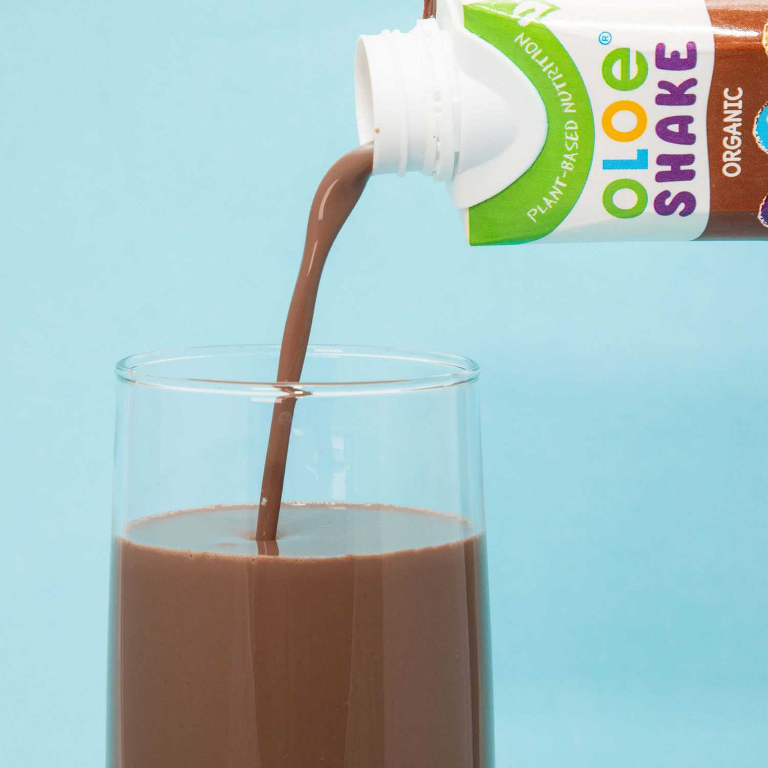 OLOE Shake - Curious Choc - Poured into a glass to show the velvety smooth texture